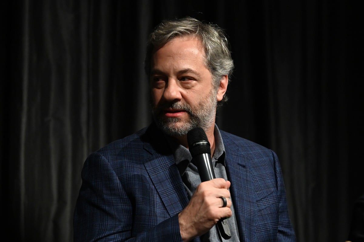 Judd Apatow holds a microphone while attending aq and a.