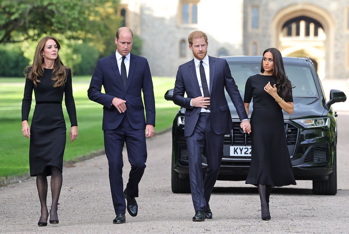 Kate Middleton, Prince William, Prince Harry, and Meghan Markle walk outside Windsor Castle on Sept. 10 in an appearance a body language expert called a 'damage limitation exercise'