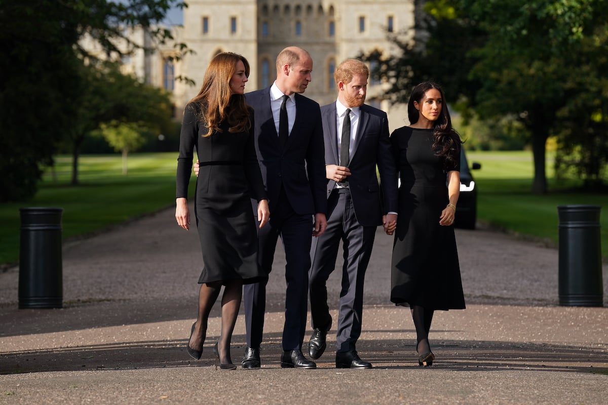 Kate Middleton and Prince Harry, who said Windsor Castle is different without Queen Elizabeth II, walk with Prince William and Meghan Markle outside Windsor Castle following Queen Elizabeth II's death