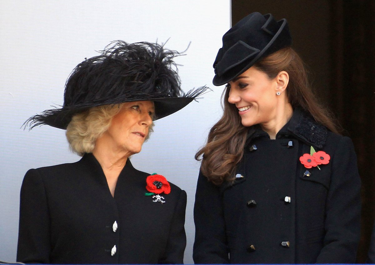 Kate Middleton, now the Princess of Wales, formerly the Duchess of Cambridge and Camilla Parker Bowles, now Queen Consort of the United Kingdom, formerly the Duchess of Cornwall smile during the Remembrance Day Ceremony at the Cenotaph on November 13, 2011 in London, United Kingdom