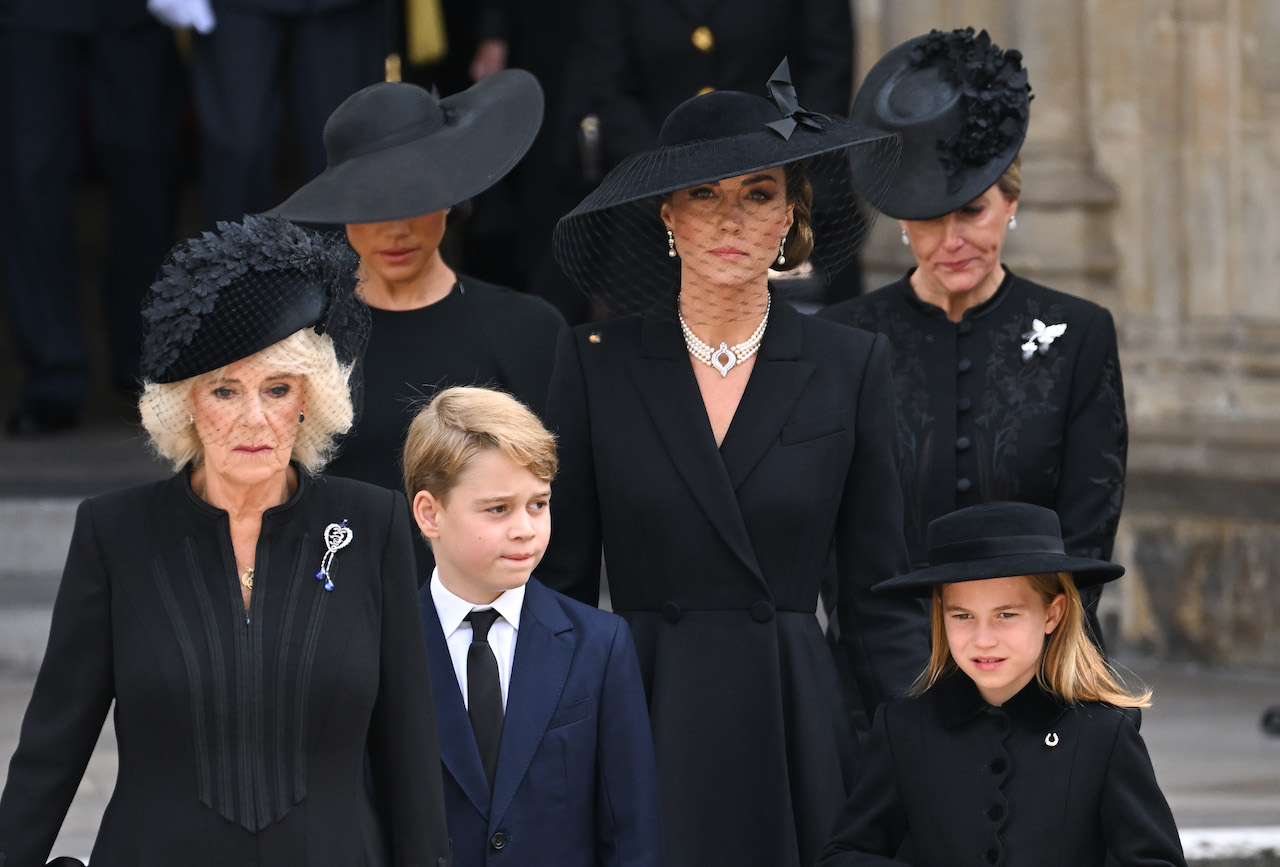 (L-R) Camilla, Queen Consort, Meghan, Duchess of Sussex, Prince George of Wales, Catherine, Princess of Wales, Princess Charlotte of Wales, and Sophie, Countess of Wessex