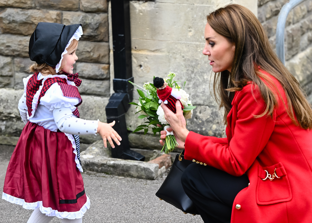 Kate Middleton, Princess of Wales, meets two-year-old Charlotte Bunting in Wales.