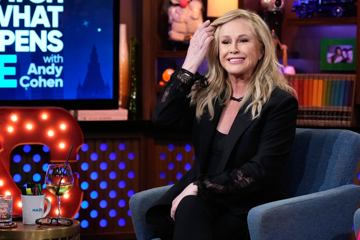 Kathy Hilton fixes her hair during an appearance on Watch What Happens Live