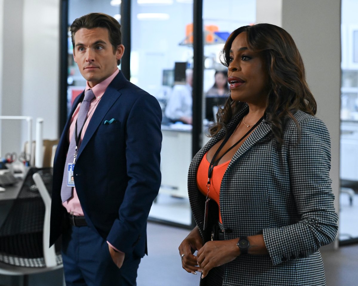 Kevin Zegers and Niecy Nash-Betts wearing suits in the series premiere of 'The Rookie: Feds'
