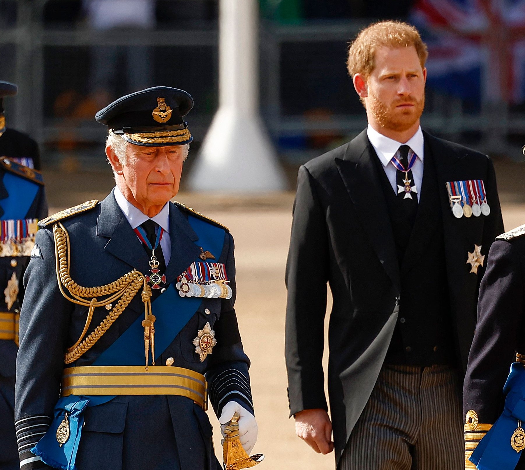 King Charles III and Prince Harry, who may want his kids to get titles before his memoir comes out, walking in procession behind Queen Elizabeth II's coffin from Buckingham Palace to the Palace of Westminster