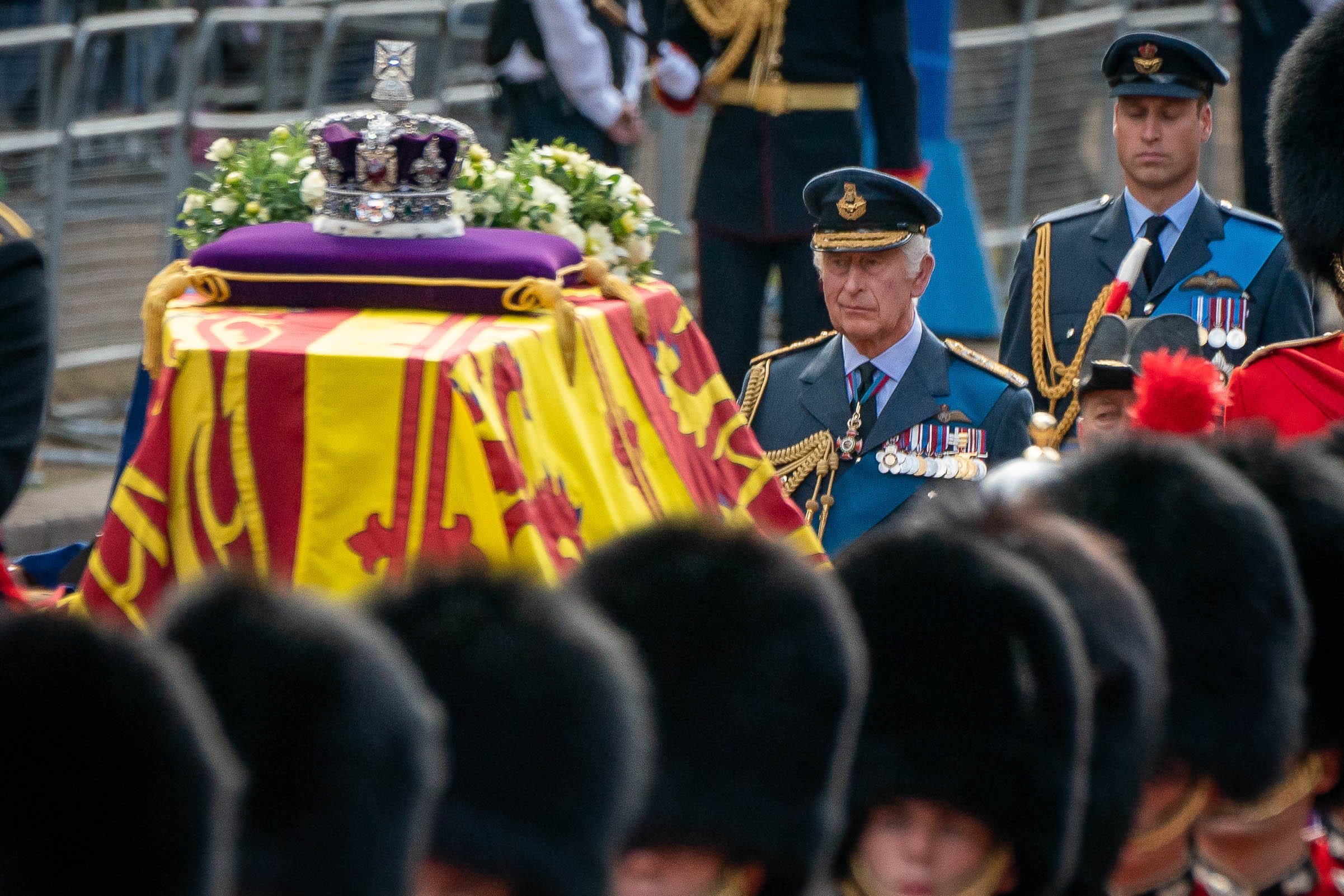 King Charles III and Prince William walk behind the coffin of Queen Elizabeth II