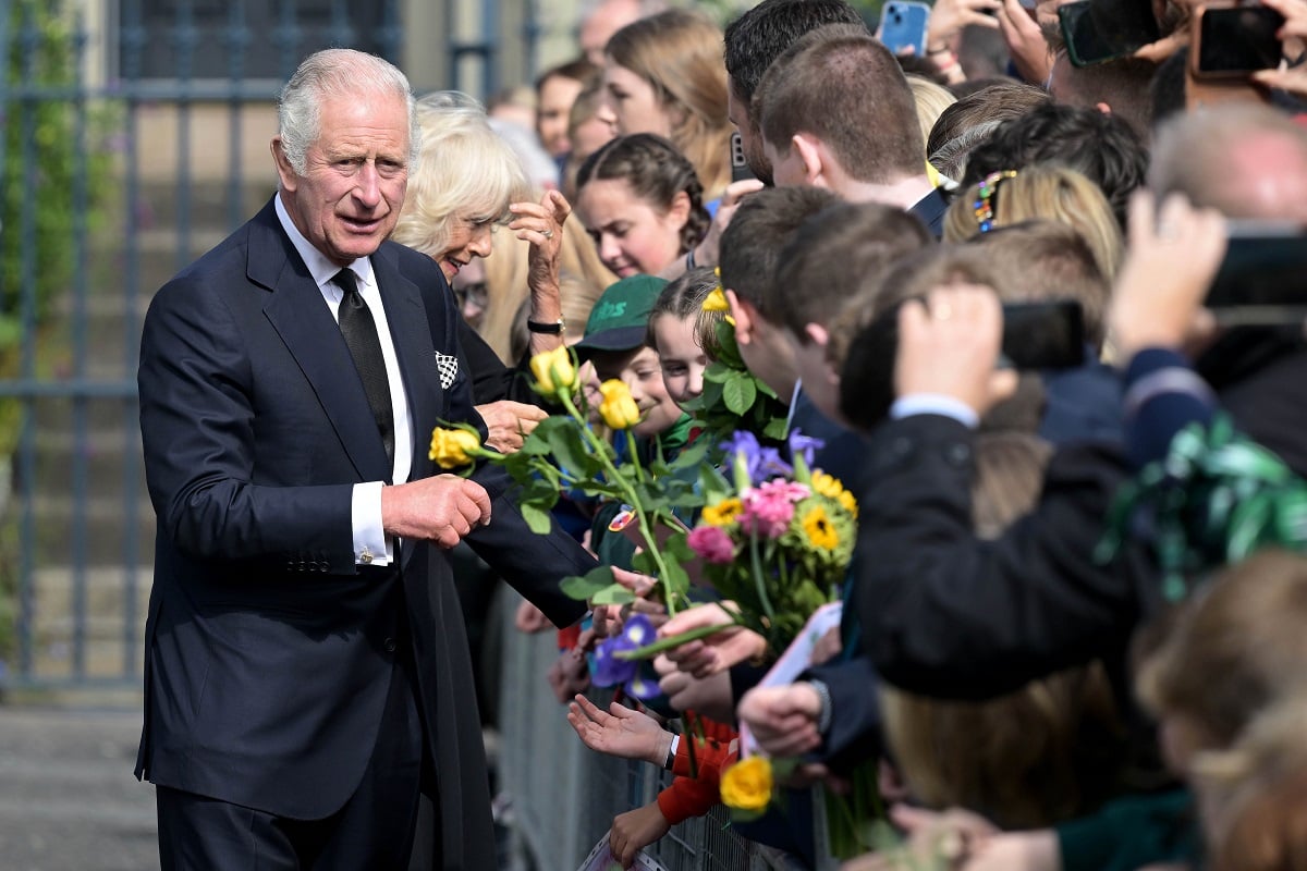 King Charles III, who lost his temper when a fountain pen leaked, is greeted by members of the public outside Hillsborough Castle in Northern Ireland