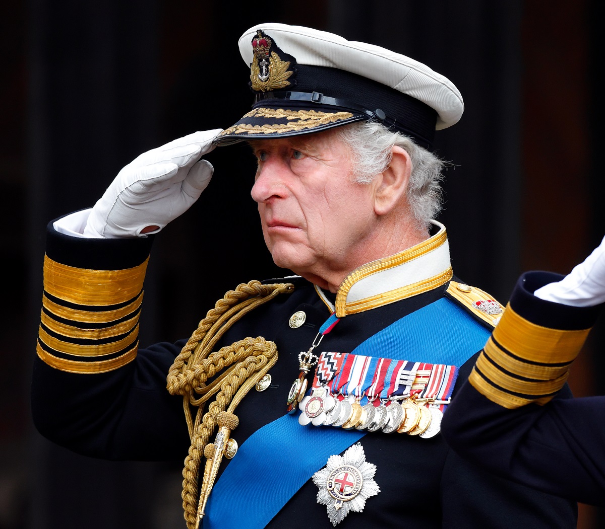 King Charles III salutes his mother Queen Elizabeth II's coffin as he attends the Committal Service