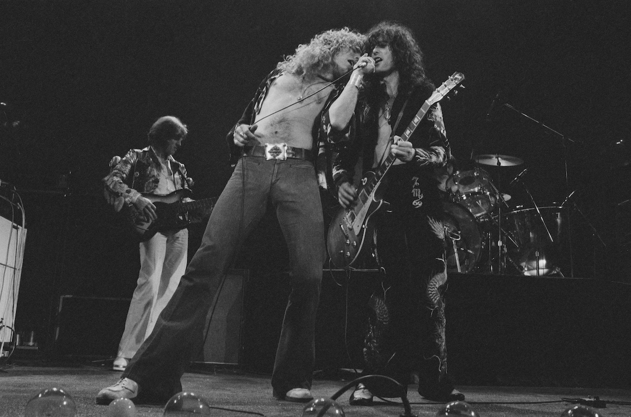 John Paul Jones (background), Robert Plant (left), and Jimmy Page during a 1975 Led Zeppelin, who earned a $2 million paycheck for one song nearly 50 years later.