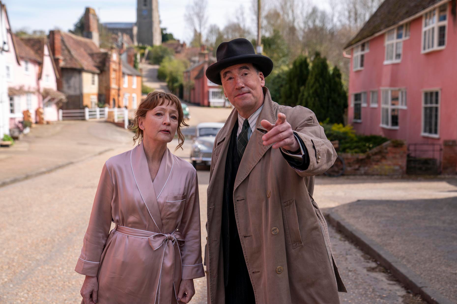 Lesley Manville standing next to Timothy McMullan in the PBS series 'Magpie Murders'