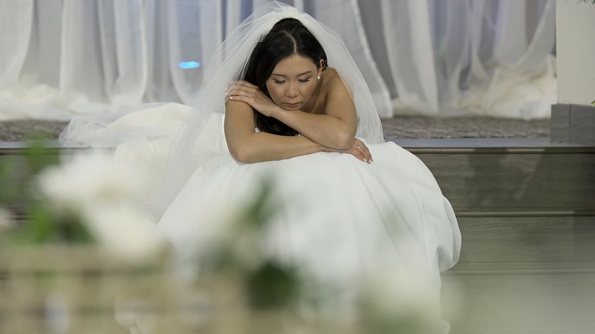 Natalie wearing a wedding dress and looking downcast on 'Love Is Blind' Season 2