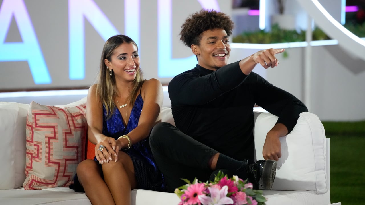 'Love Island USA' couple Phoebe Siegel and Chad Robinson sitting down next to each other