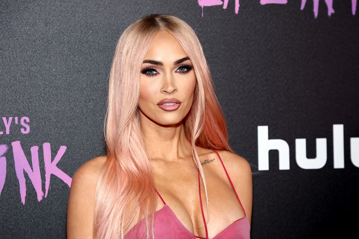 Megan Fox posing at Machine Gun Kelly's 'Pretty In Pink' premiere.