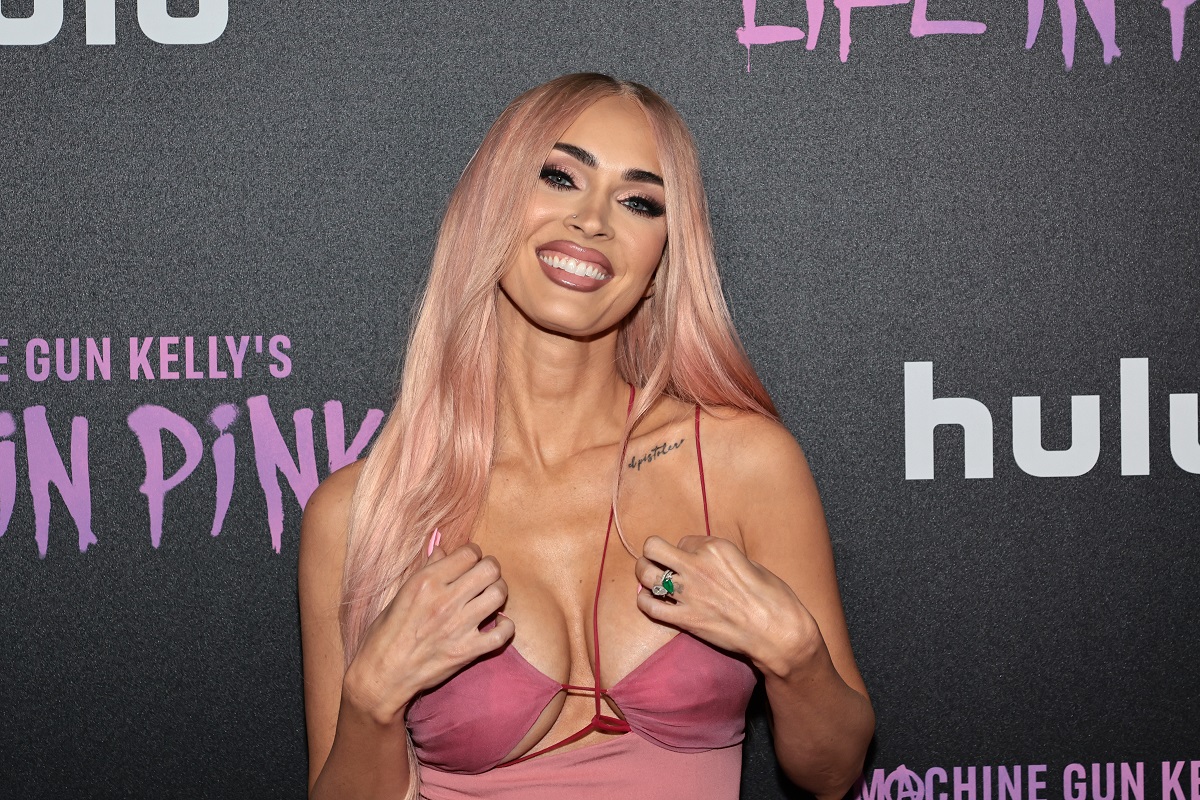 Megan Fox smiling while posing for the 'Life In Pink' premiere.