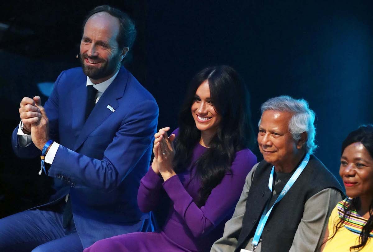 Meghan Markle who, according to a body language expert, hinted at wanting to 'cut off' people at the 2019 One Young World Summit, claps