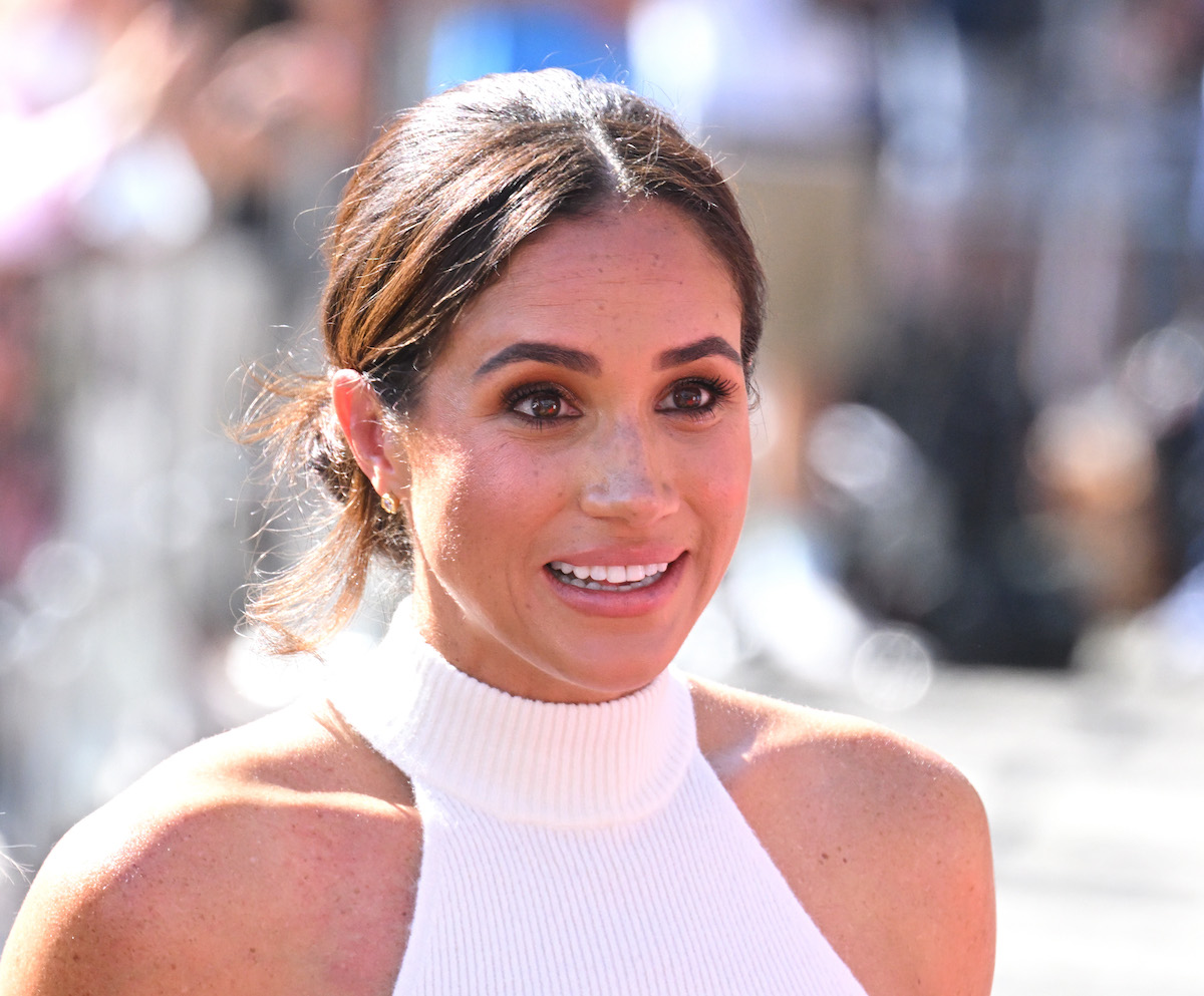Meghan Markle, whose backpack lesson with Archie Harrison Mountbatten-Windsor a commentator says couldn't be 'weirder' looks on wearing a white shirt