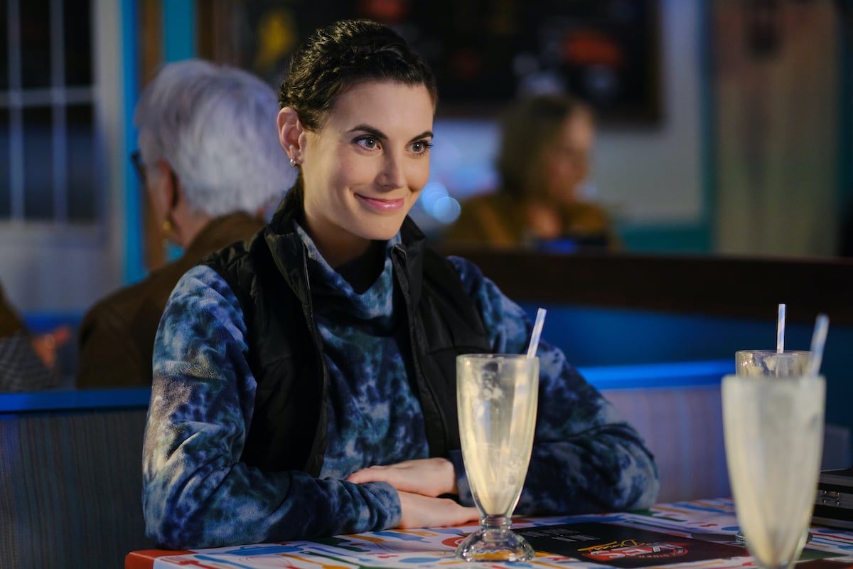 Meghan Ory sitting in front of an empty milkshake glass in 'Chesapeake Shores' Season 6