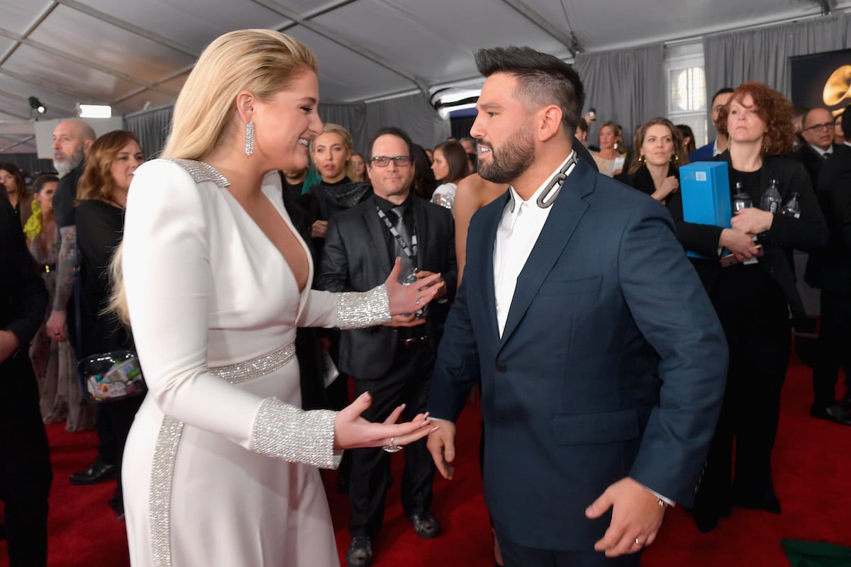 Megan Trainor and Shay Mooney of Dan + Shay speak on the red carpet of the 61st Annual GRAMMY Awards