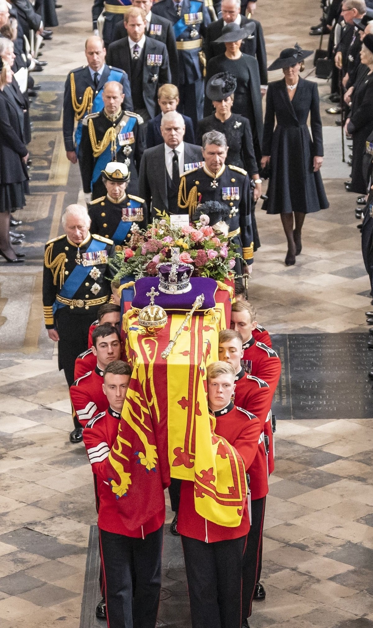 Members of the royal family follow behind the coffin of Queen Elizabeth II as it is carried out of Westminster Abbey