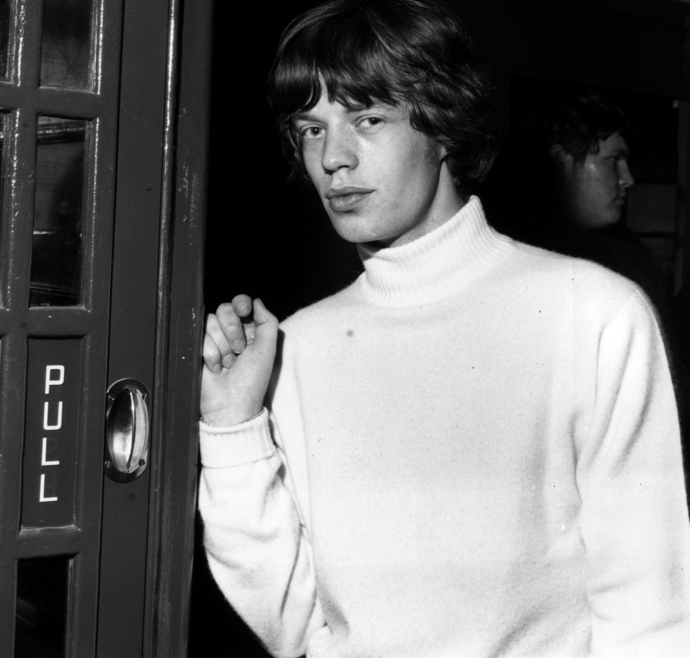 The Rolling Stones' Mick Jagger near a door
