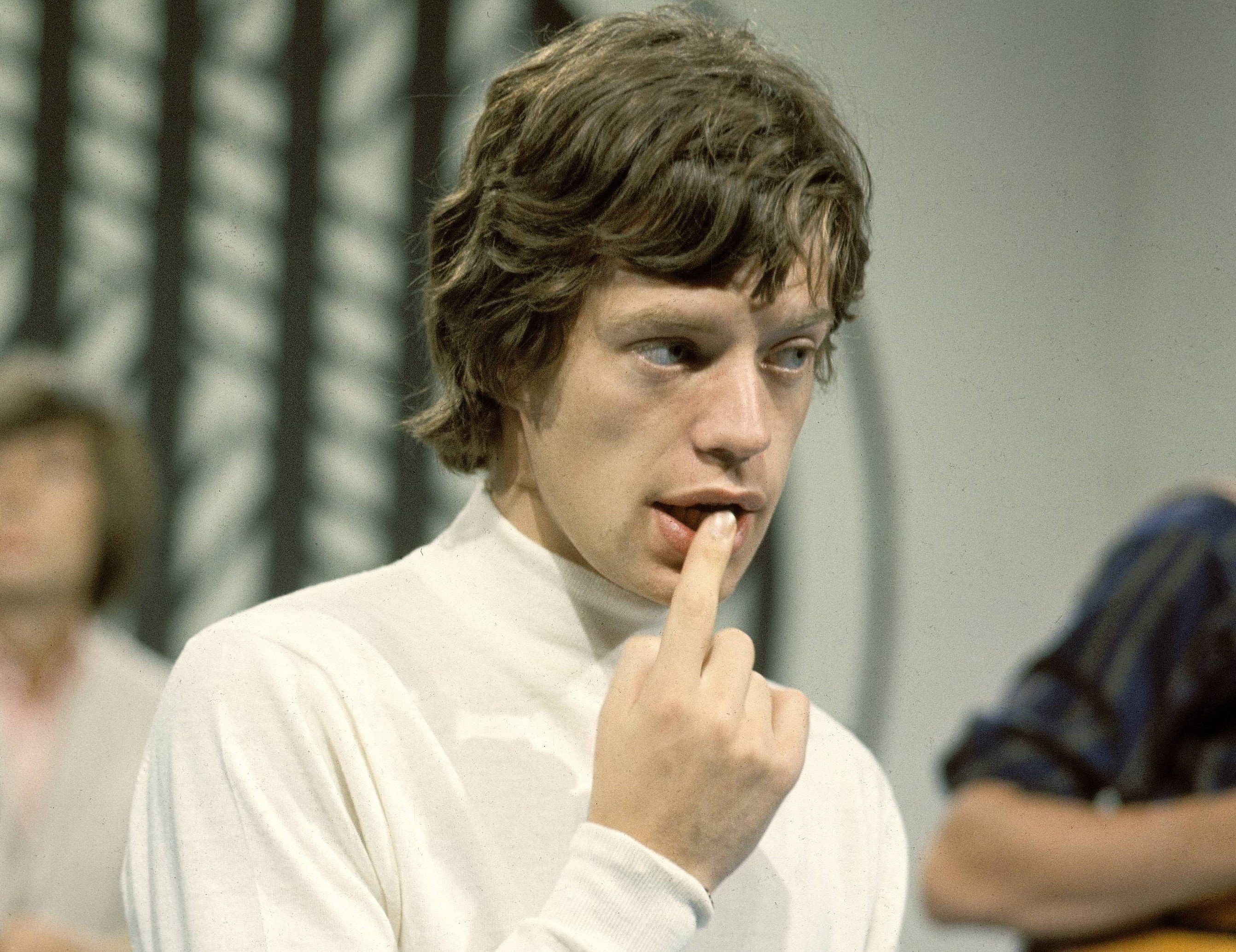 The Rolling Stones' Mick Jagger with a finger in his mouth