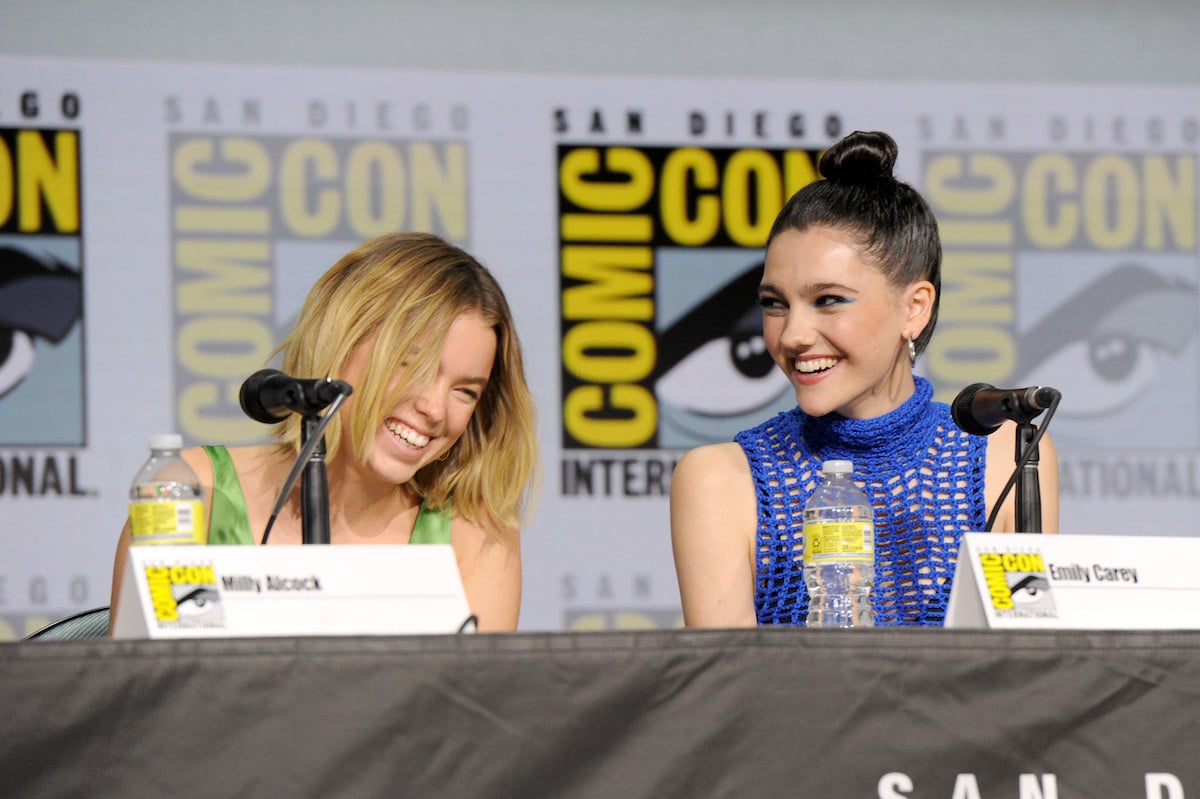 Milly Alcock and Emily Carey speak onstage at the "House of the Dragon" panel during 2022 Comic Con