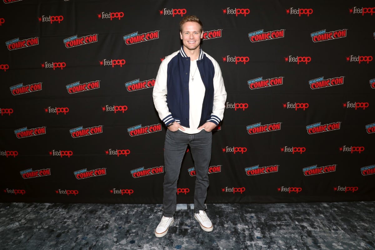 Outlander star Sam Heughan poses for a photo op during the Outlander panel on Day 3 of New York Comic Con 2021 at the Jacob Javits Center on October 09, 2021 in New York