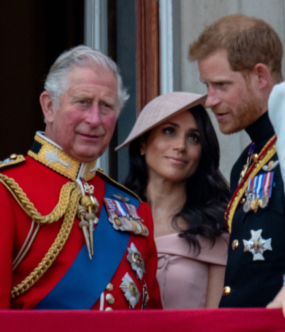Prince Charles standing on the royal balcony with Meghan Markle and Prince Harry during Trooping the Colour in 2018