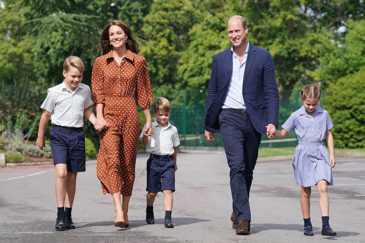 Kate Middleton and Prince William, who are reportedly delaying Windsor Castle move, walk with their children, Prince George, Prince Louis, and Princess Charlotte