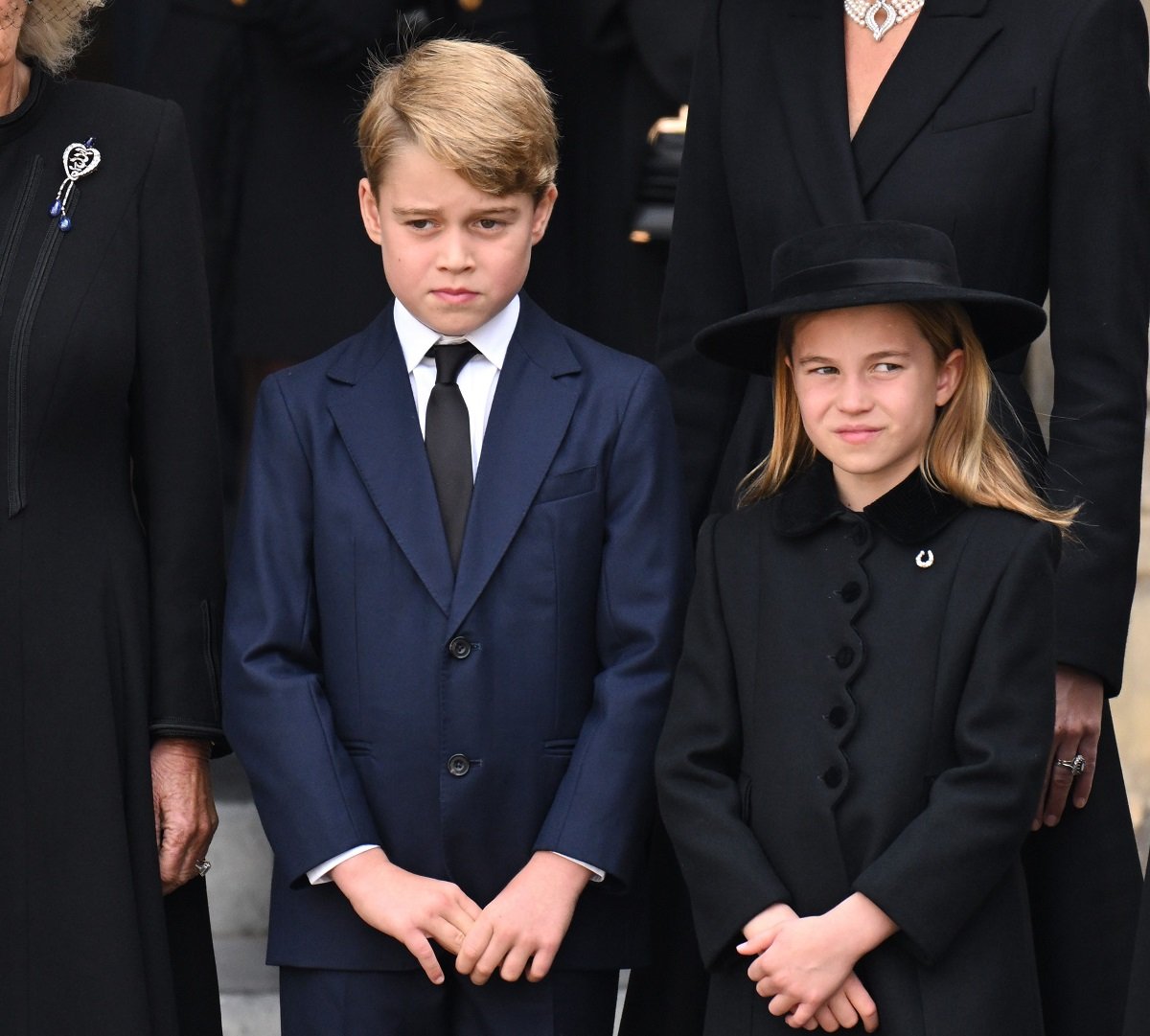 Prince George and Princess Charlotte, who reminded her big brother when to bow, at the queen's funeral, at the State Funeral of their great-grandmother Queen Elizabeth II