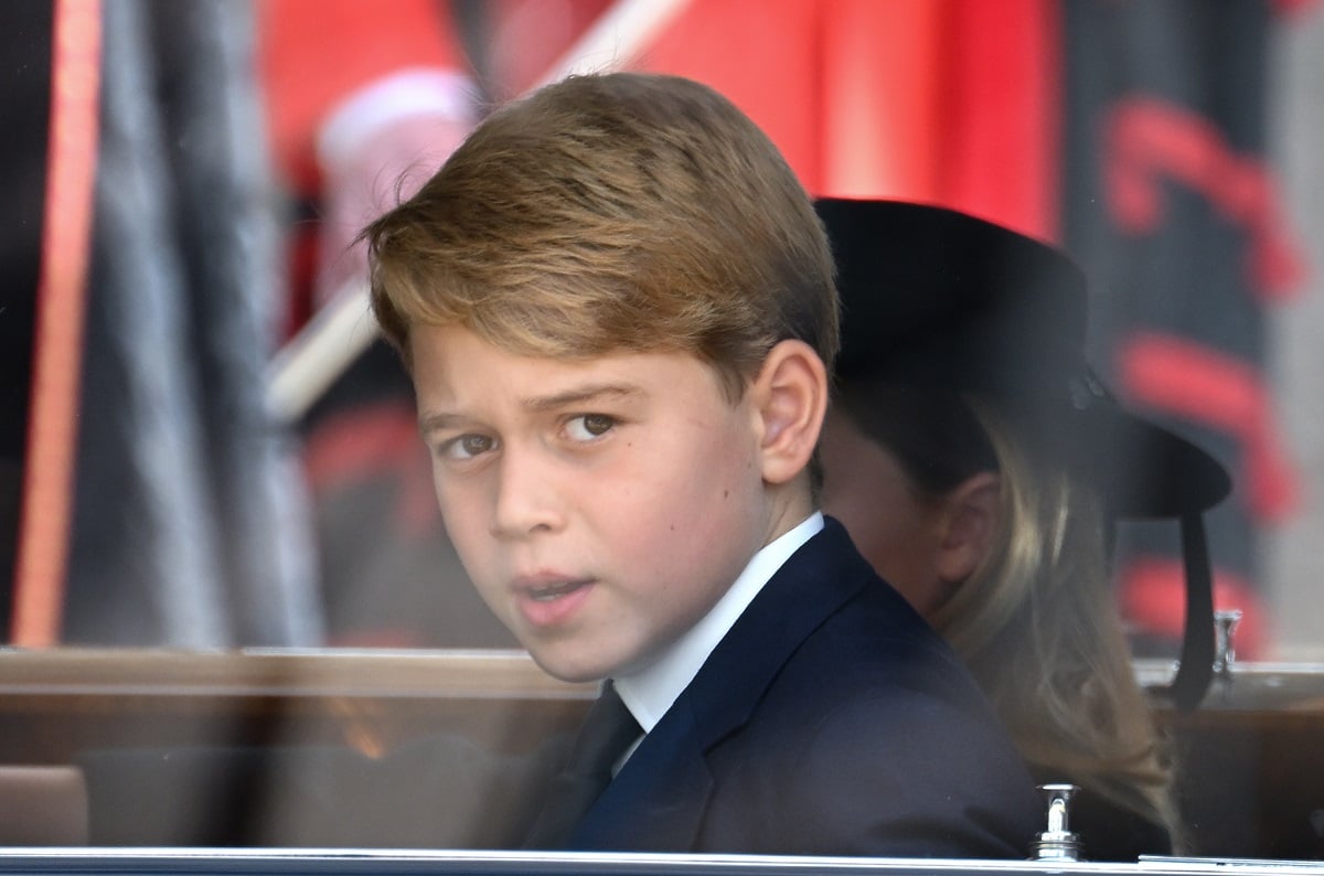 Prince George, who told classmates "my dad will be king so you better watch out," departs Westminster Abbey after attending the State Funeral of Queen Elizabeth II