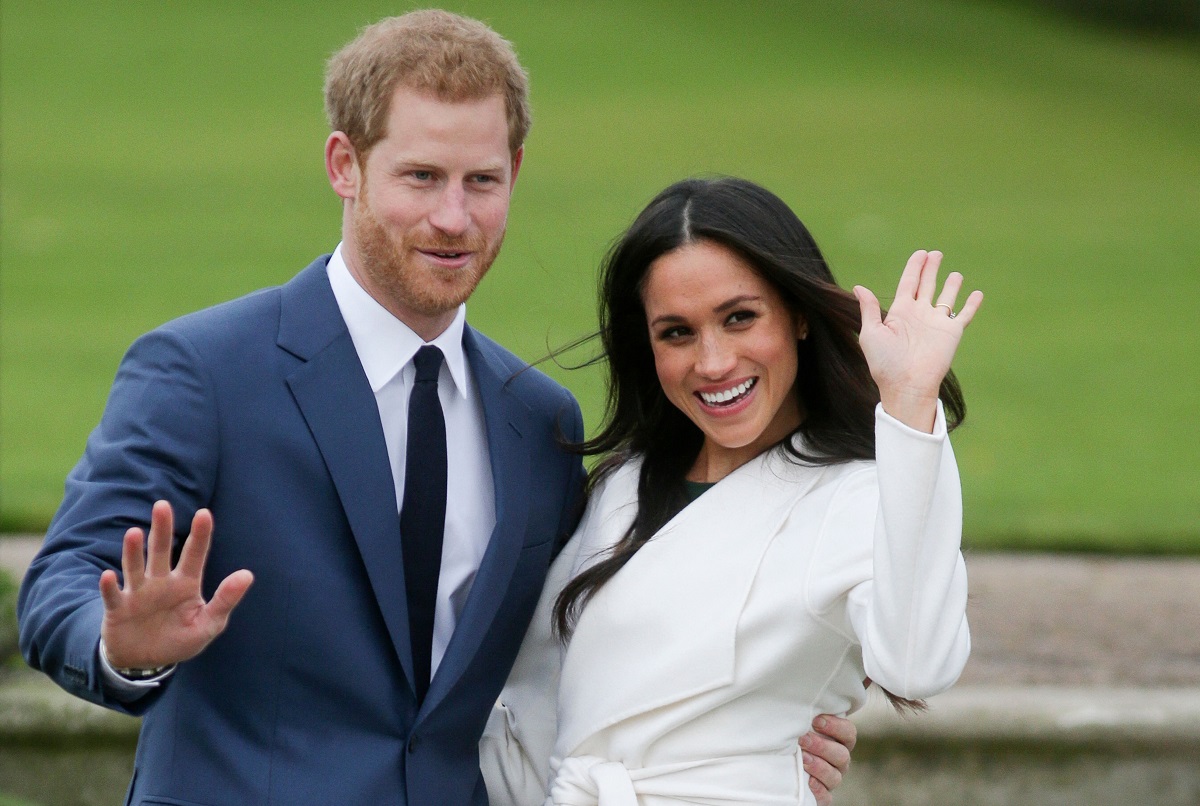 Prince Harry and Meghan Markle pose together at Kensington Palace after announcing their engagement