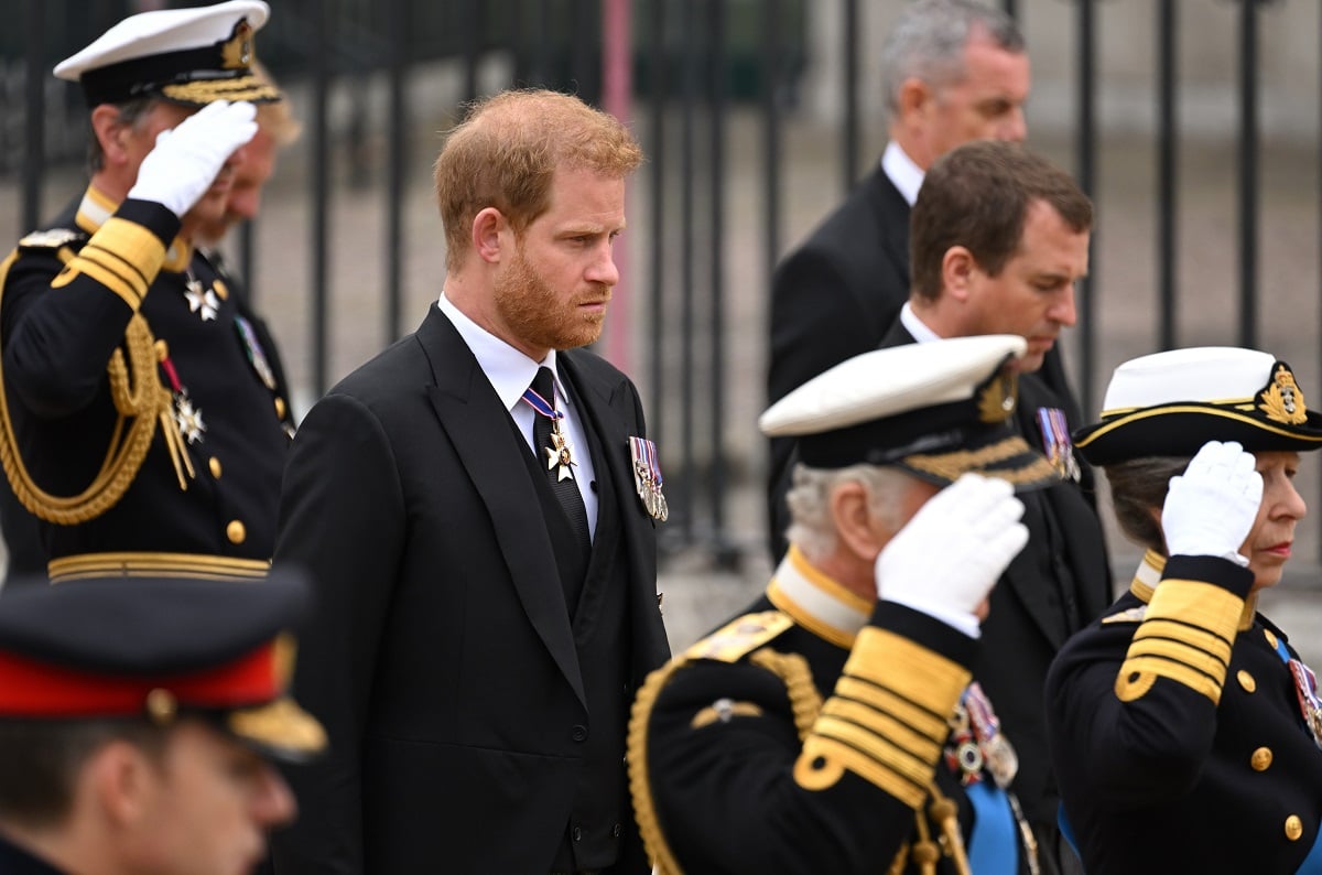 Prince Harry, who a body language expert said made a gesture that he wanted a more 'active role' at Queen Elizabeth's funeral, standing with members of the royal family saluting at Queen Elizabeth II's funeral