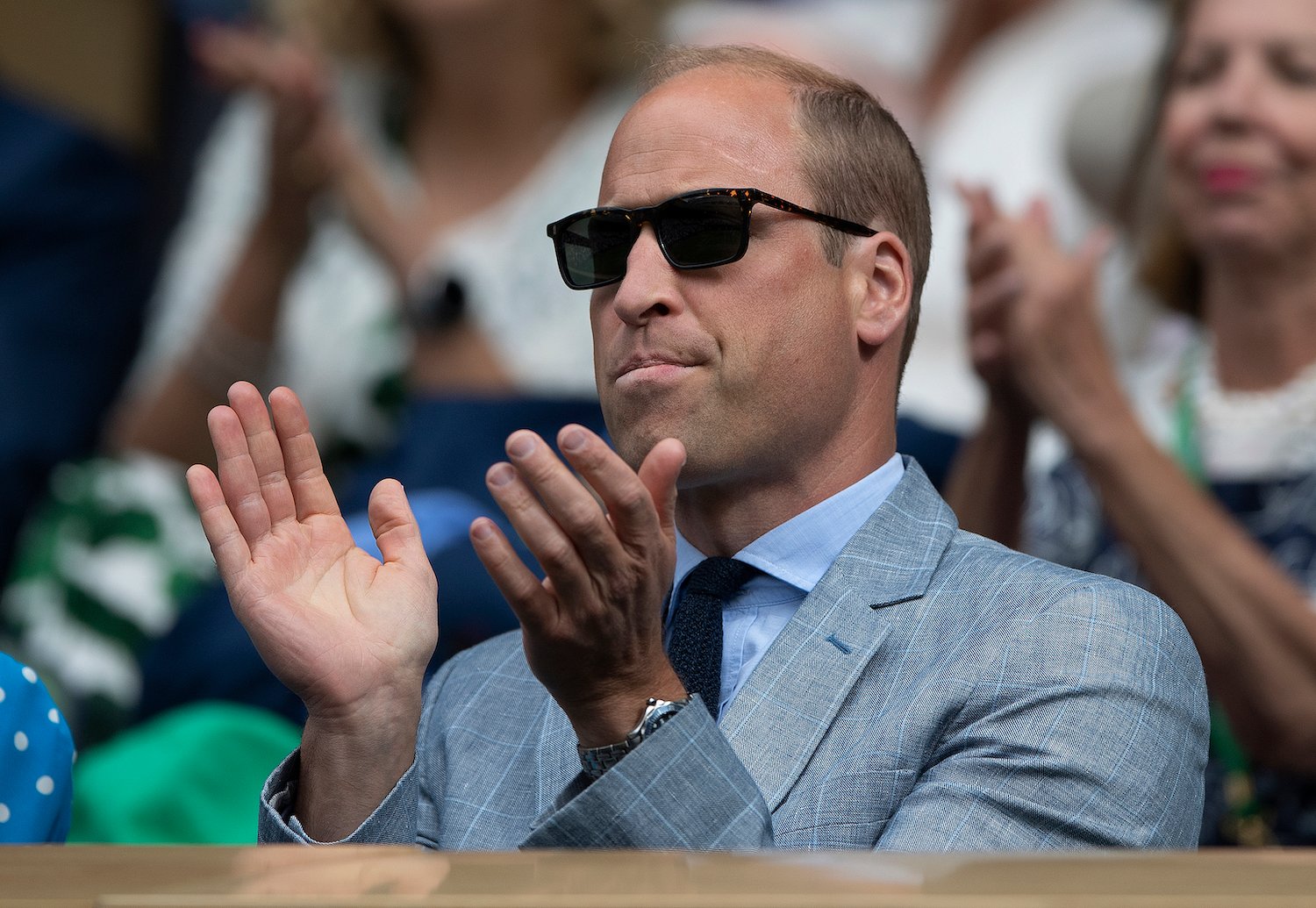 Prince William, Duke of Cambridge, wearing a suit and sunglasses.