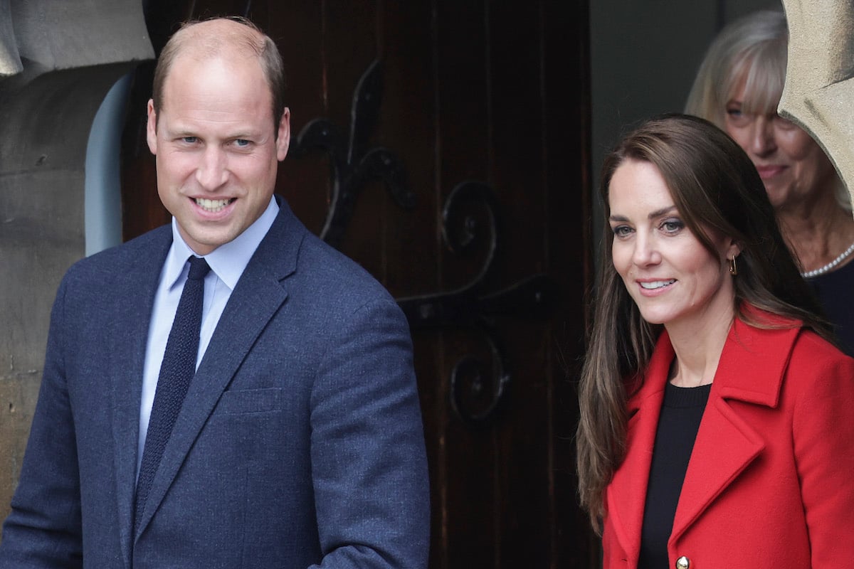 Prince William and Kate Middleton, who didn't flash their 'royal smiles' in Wales on Sept. 27, 2022, according to body language expert Judi James, smile in Wales