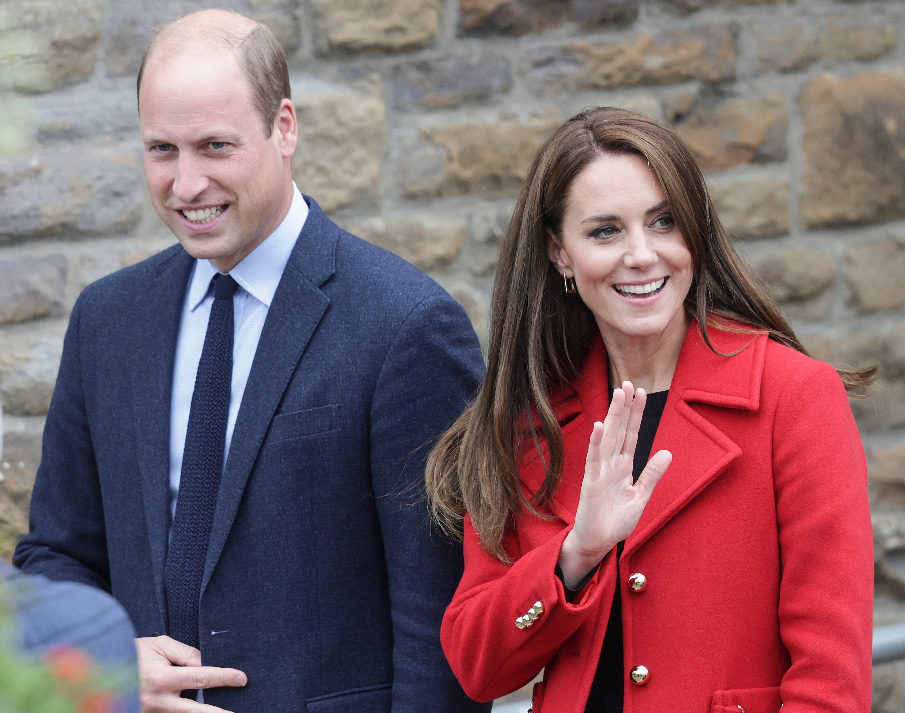 Prince William and Kate Middleton smile and wave to crowd as they leave church in Swansea, Wales