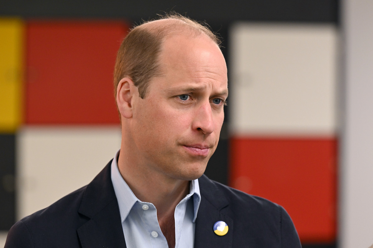 Prince William, who a commentator says skipped lunch with Queen Elizabeth and Prince Harry in a 'very clear indicator' he was 'angry' at Sandringham crisis meeting over Prince Harry and Meghan Markle stepping back, looks on