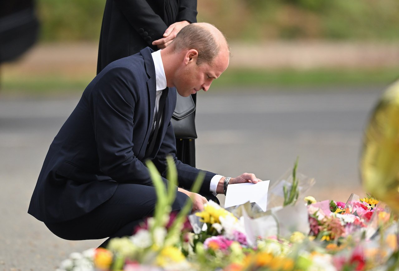 Prince William, future monarch, views the flowers outside Sandringham, Norfolk, UK.