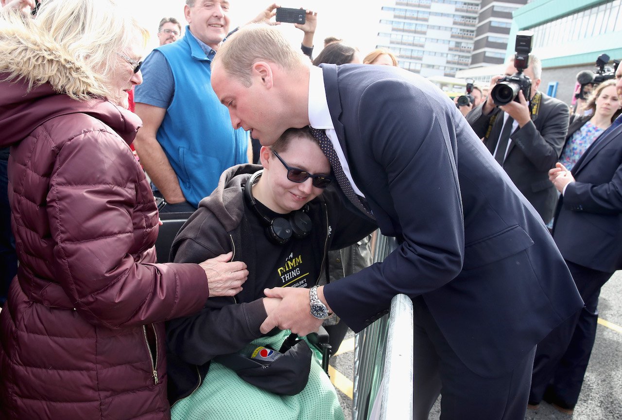 Prince William hugs Katie Daley during a visit to Aintree University Hospital on September 14, 2017 in Liverpool, England. 