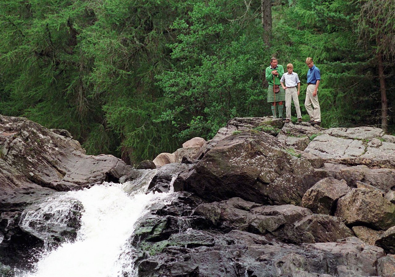 King Charles, Prince Harry, and Prince William at Glen Muick Falls on the Balmoral Castle Estate in Scotland.