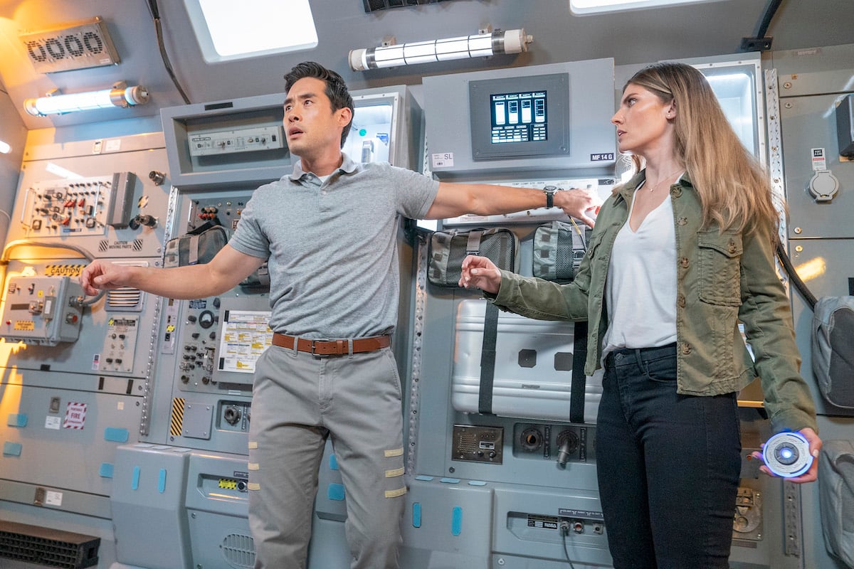'Quantum Leap': Raymond Lee and Caitlin Bassett stand in a shuttle