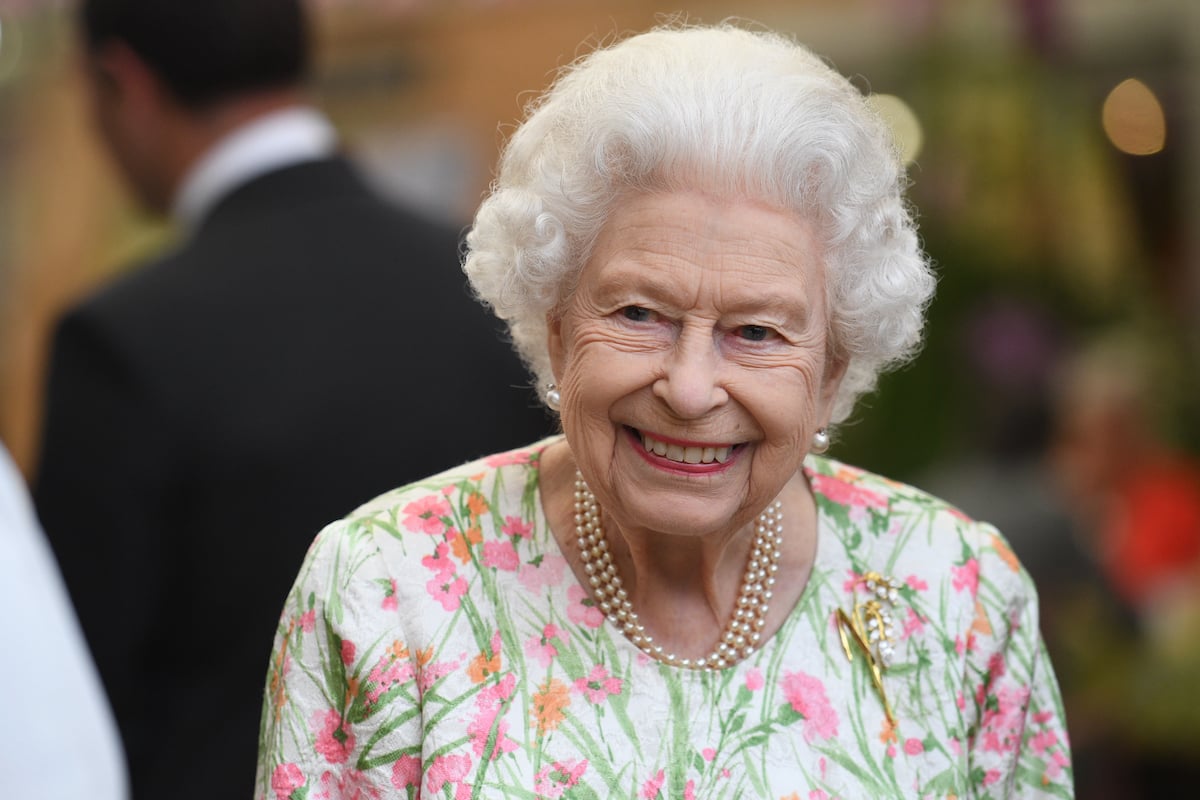 Queen Elizabeth, who appeared in a James Bond video with Daniel Craig and reportedly improvised her line, smiles