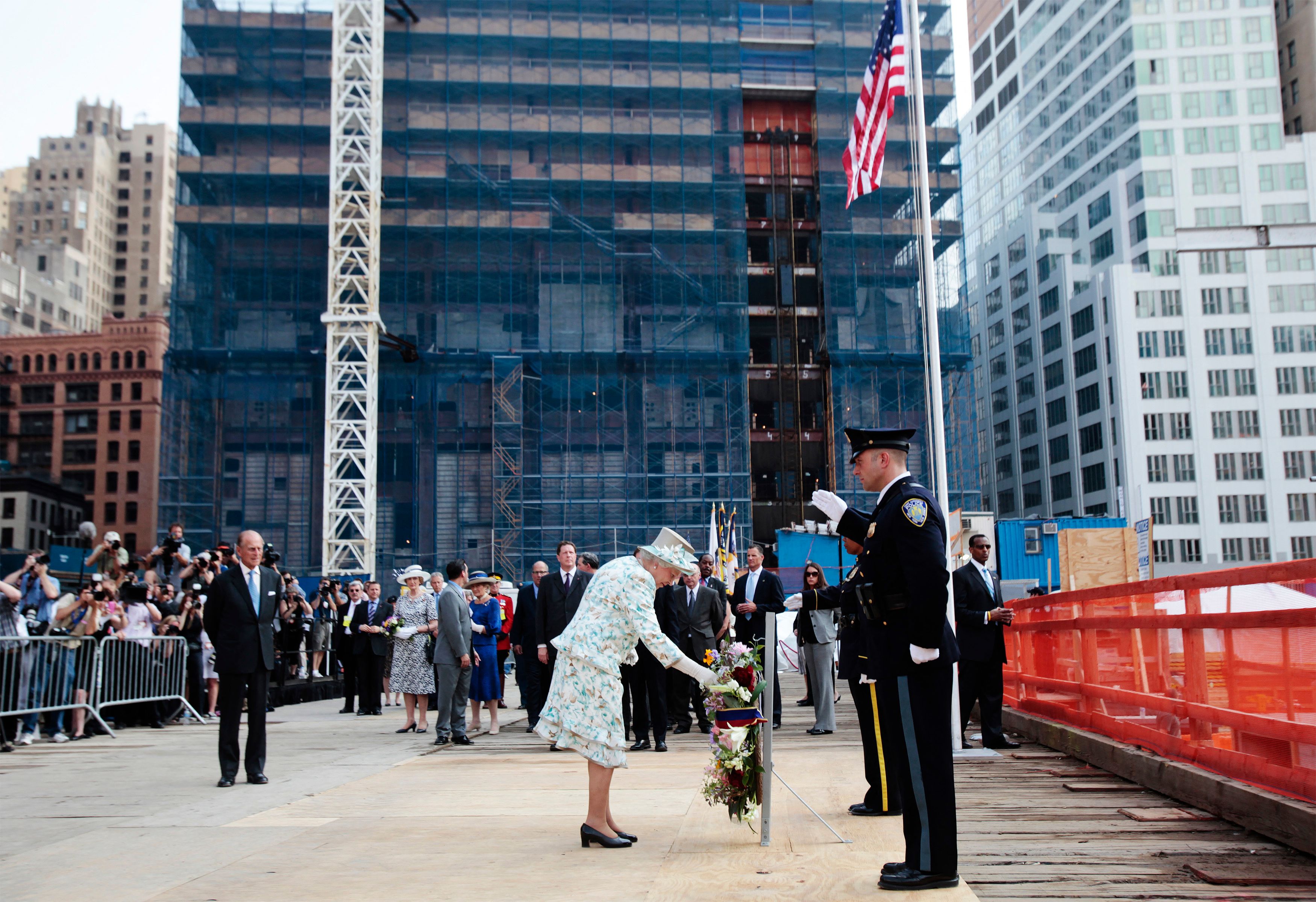 Queen Elizabeth II stands back after dedicating a wreath of flowers at the site of the September 11, 2001 World Trade Center attack during her visit to New York July 6, 2010.