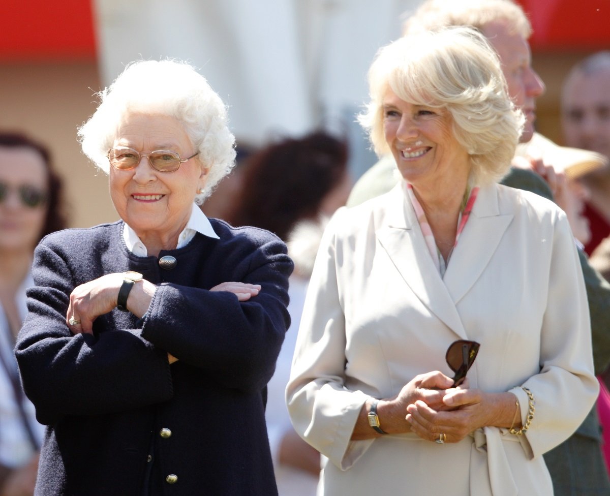 Queen Elizabeth II and Camilla Parker Bowles watch the queen's horse 'Tower Bridge' race
