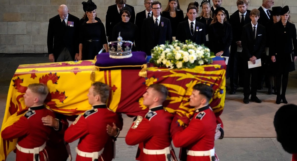 Queen Elizabeth II’s coffin being carried past Mike Tindall, Zara Tindall, Princess Eugenie, Jack Brooksbank, Edoardo Mapelli Mozzi, Princess Beatrice, James, Viscount Severn, and Lady Louise Windsor