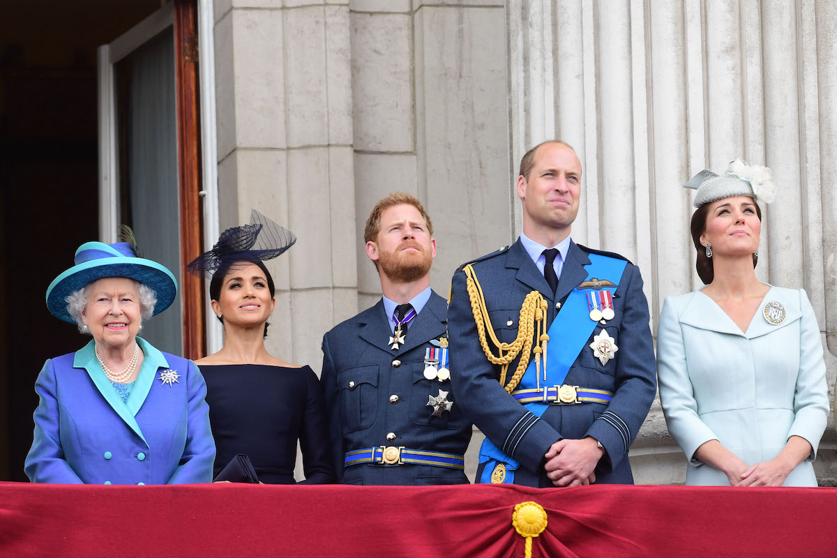 Queen Elizabeth, Meghan Markle, and Prince Harry stand next to Prince William, who reportedly skipped lunch with Queen Elizabeth and Prince Harry ahead of a meeting at Sandringham about Prince Harry and Meghan Markle stepping down as senior royals, stand next to Kate Middleton