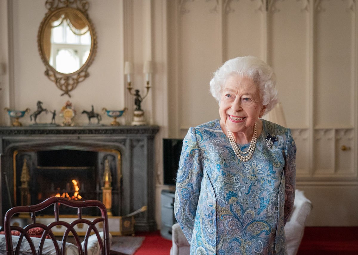 Queen Elizabeth, who Prince Harry and Kate Middleton said Windsor Castle is different without in the wake of her death, smiles inside Windsor Castle