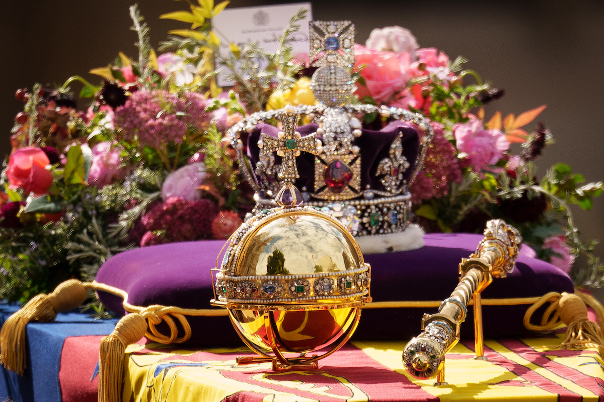 Queen Elizabeth's Imperial State Crown sits on top of her coffin next to an orb and scepter following her state funeral at Westminster Abbey