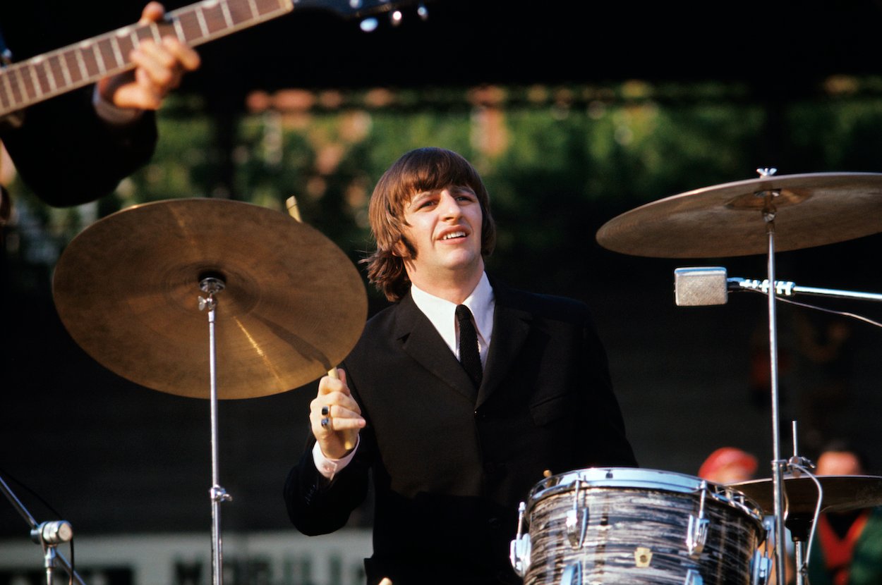 Ringo Starr drumming during a 1965 Beatles concert in Italy. Ringo's drumming skills are even more impressive when you consider he plays a kit set up for right-handed drummers.
