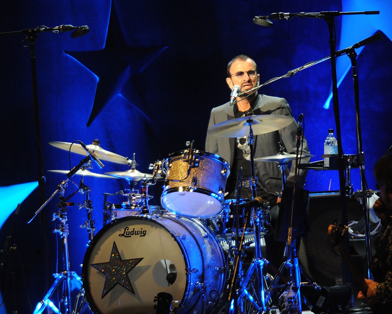 Ringo Starr, who picked up a new hobby during the coronavirus (COVID-19) pandemic, plays drums during a 2015 concert.